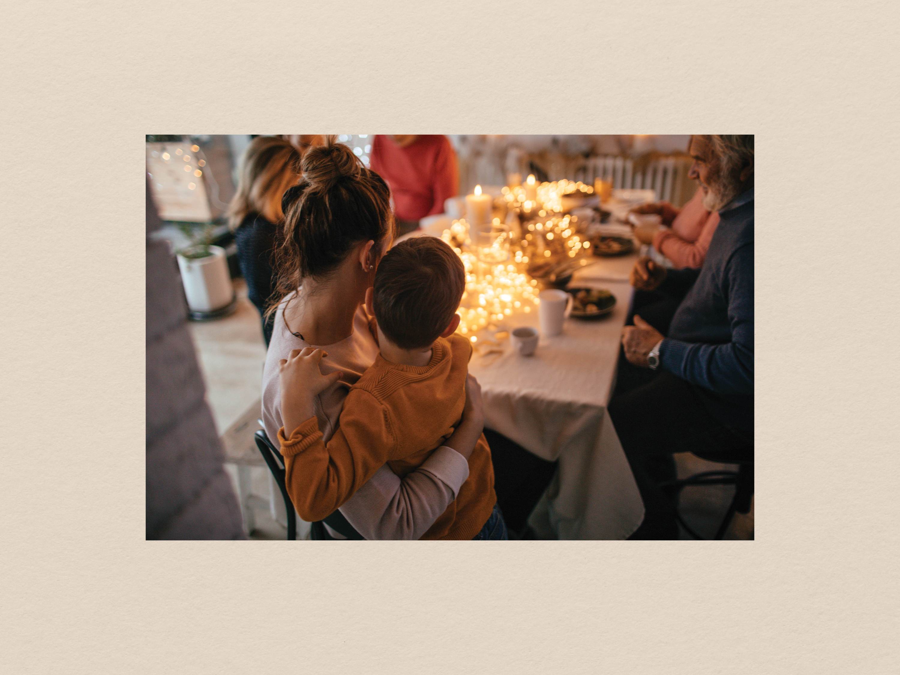 Mom holding child during holiday dinner