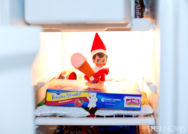 Elf on the Shelf idea 8: Elfie Rojo eating ice cream