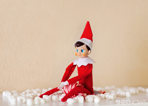 Elf on the Shelf idea 21: Elfie Rojo rides a candy cane sled